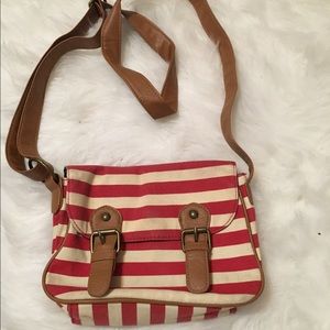 red and white striped messenger style purse