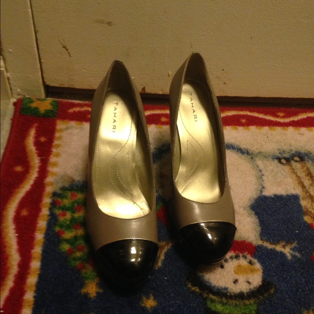 Beige heels with black toe caps