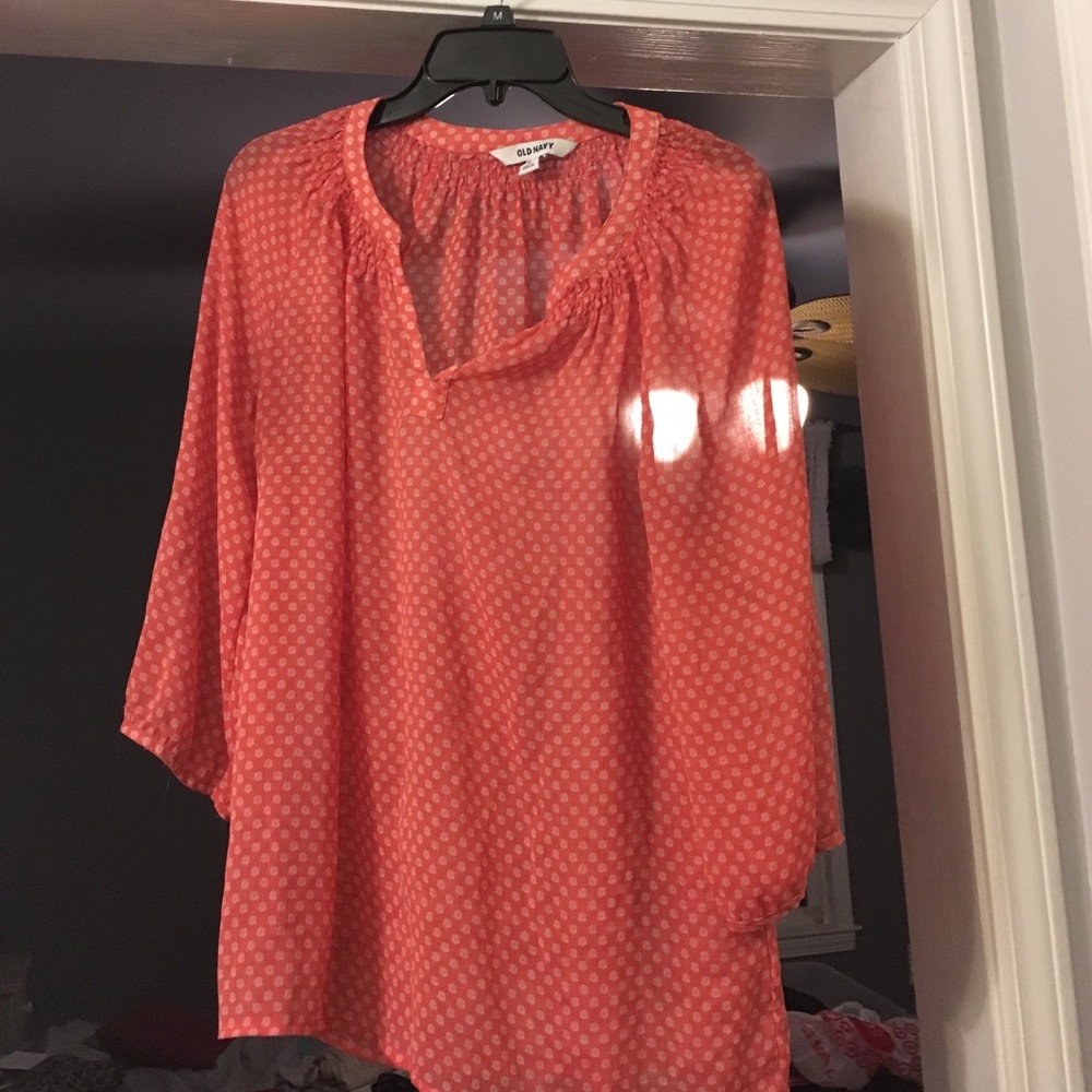 It's a orange and white sheer top