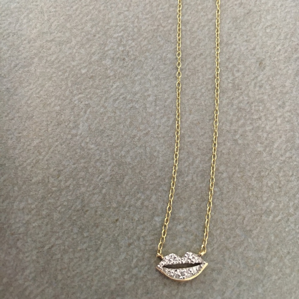Diamond lips on a 14k gold chain