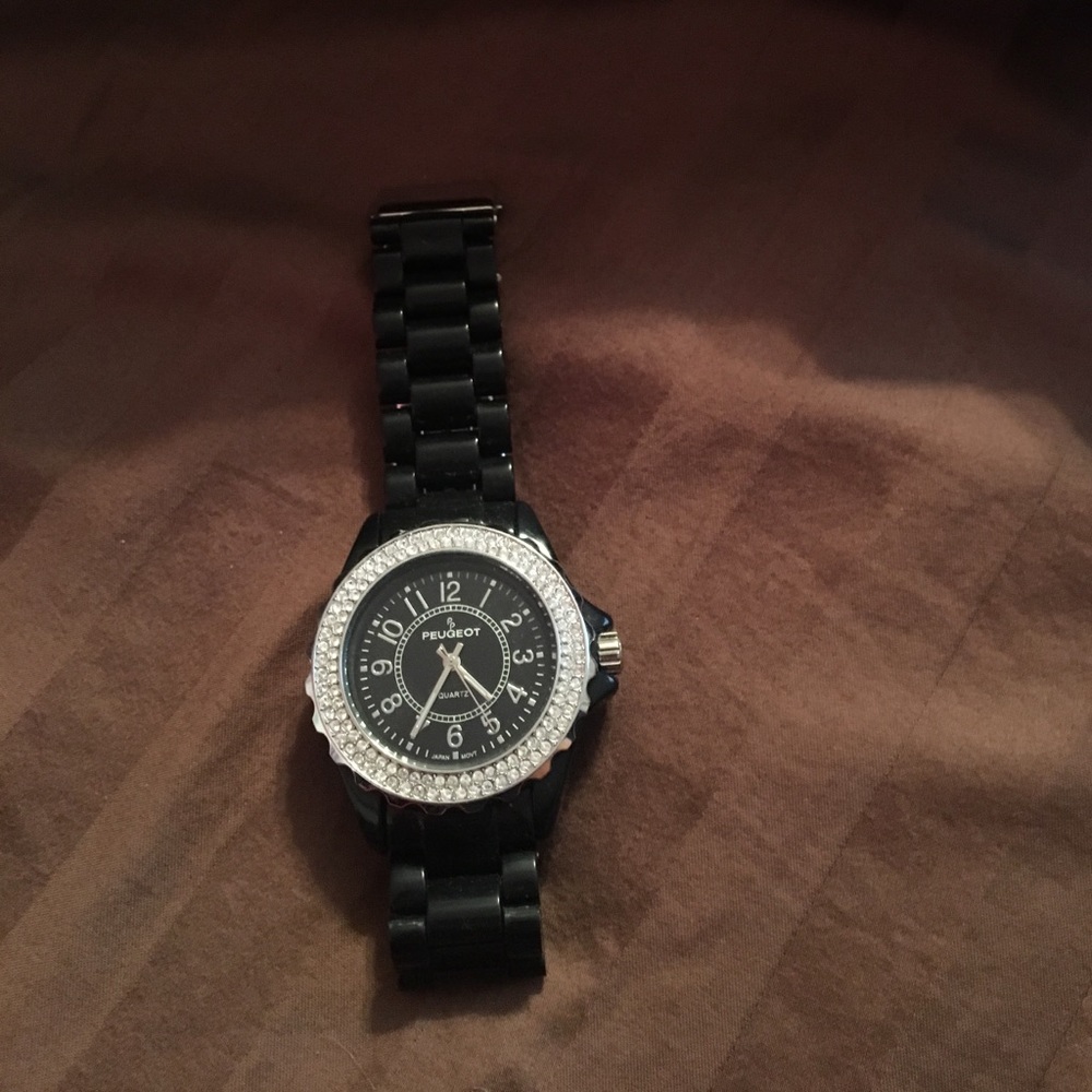 Black watch with fake diamonds