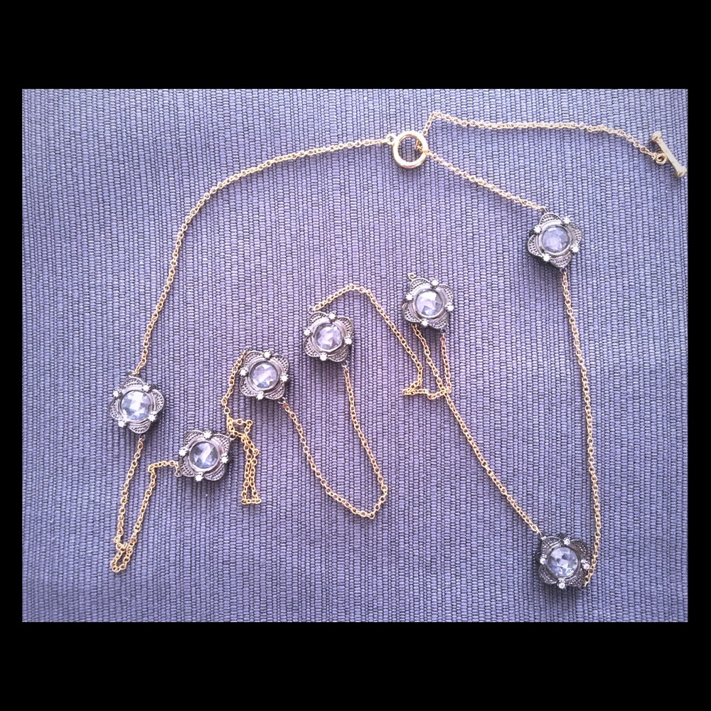 Gold Chain with Diamond pattern charms.