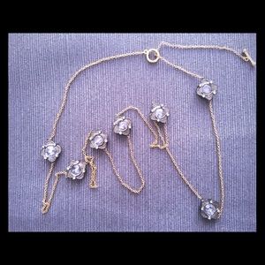 Gold Chain with Diamond pattern charms.