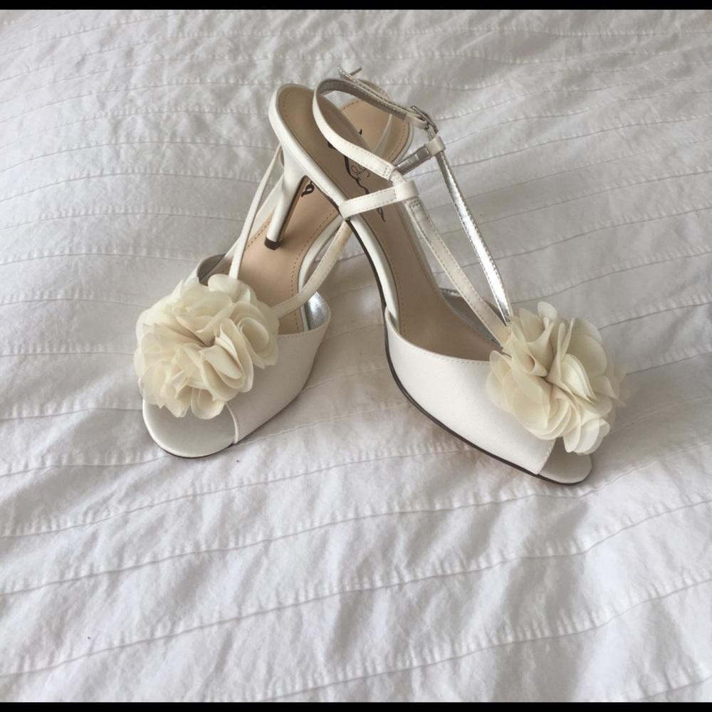White peep toe heels with flower