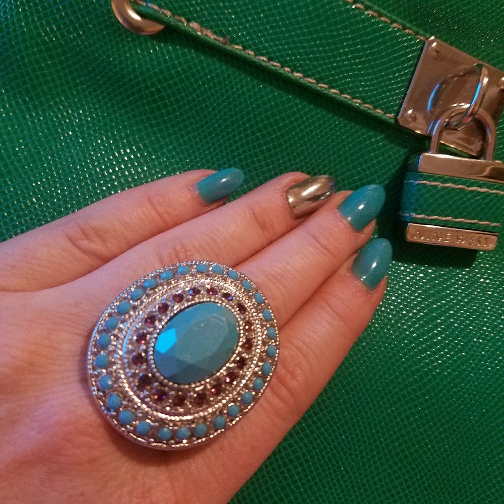 Beautiful silver and turqouise colored ring.