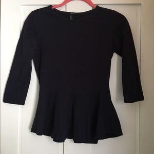 A navy blue peplum top