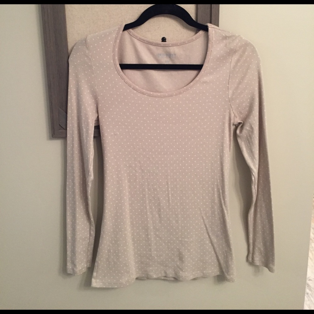 Beige long sleeve shirt with white polka dots.