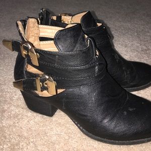 Black booties with gold buckle