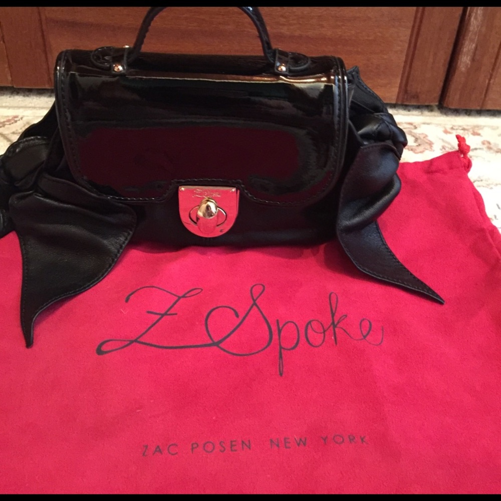 Woman's L Spoke from Saks 5 th Ave bag