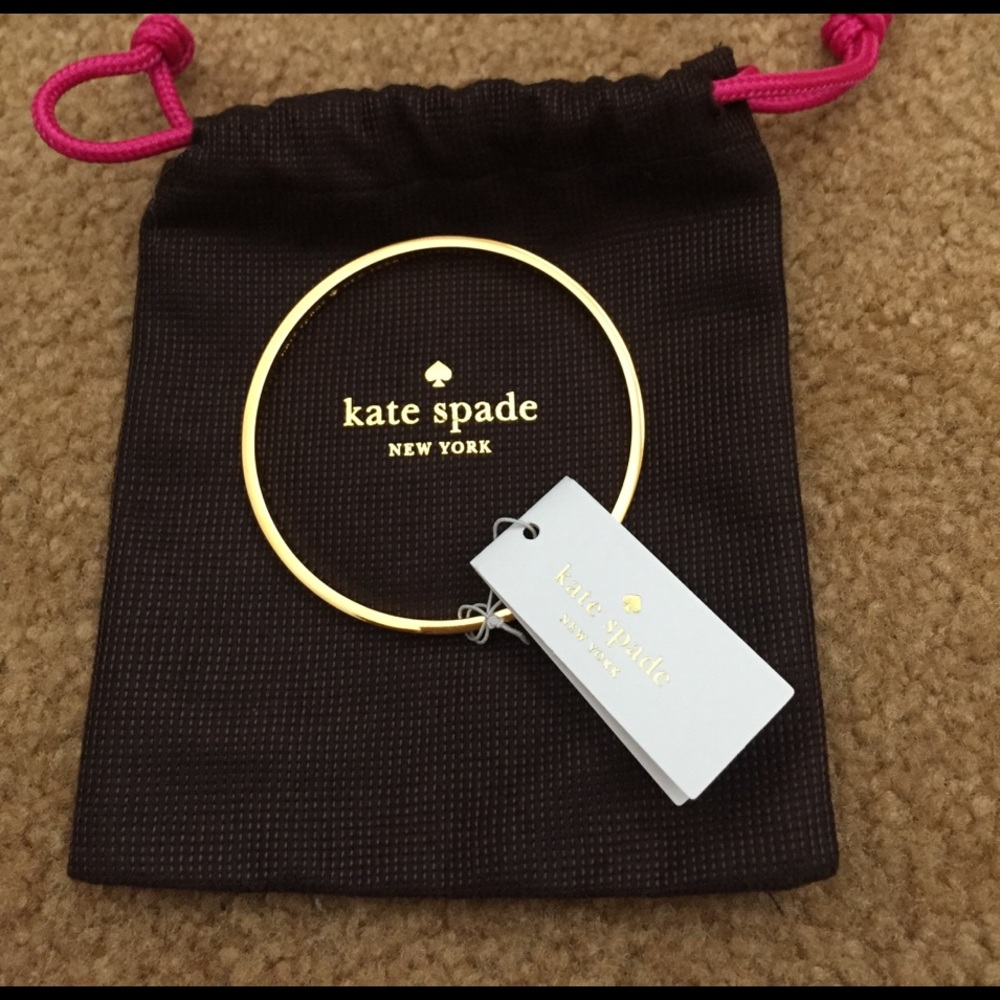 Authentic Kate Spade ivory and gold idiom bangle