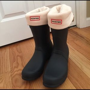 Navy hunter boots and ivory socks