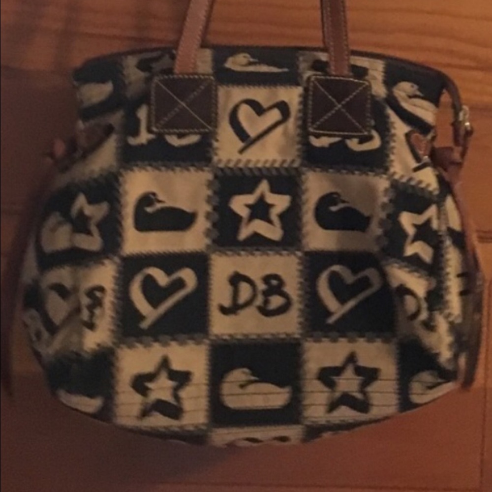 Dooney cloth bag it has leather trim.