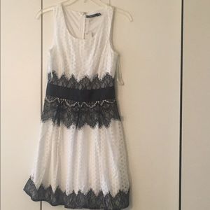 Lacy accented mod style dress in black and white!