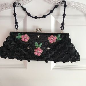 Black flowered beaded clutch