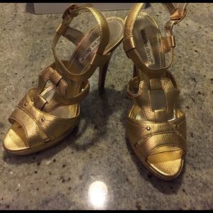 Charles David gold platform shoes.