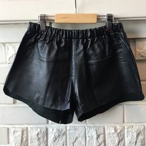 Urban Renewal Leather dolphin hem shorts