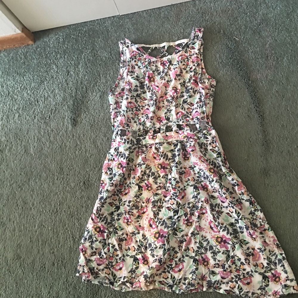 Super cute dress with cut outs on the ribs