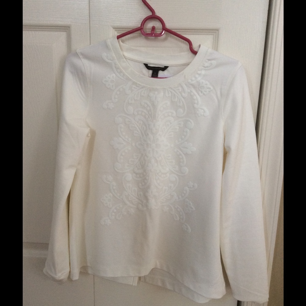 Super soft cream top raised design front & back.