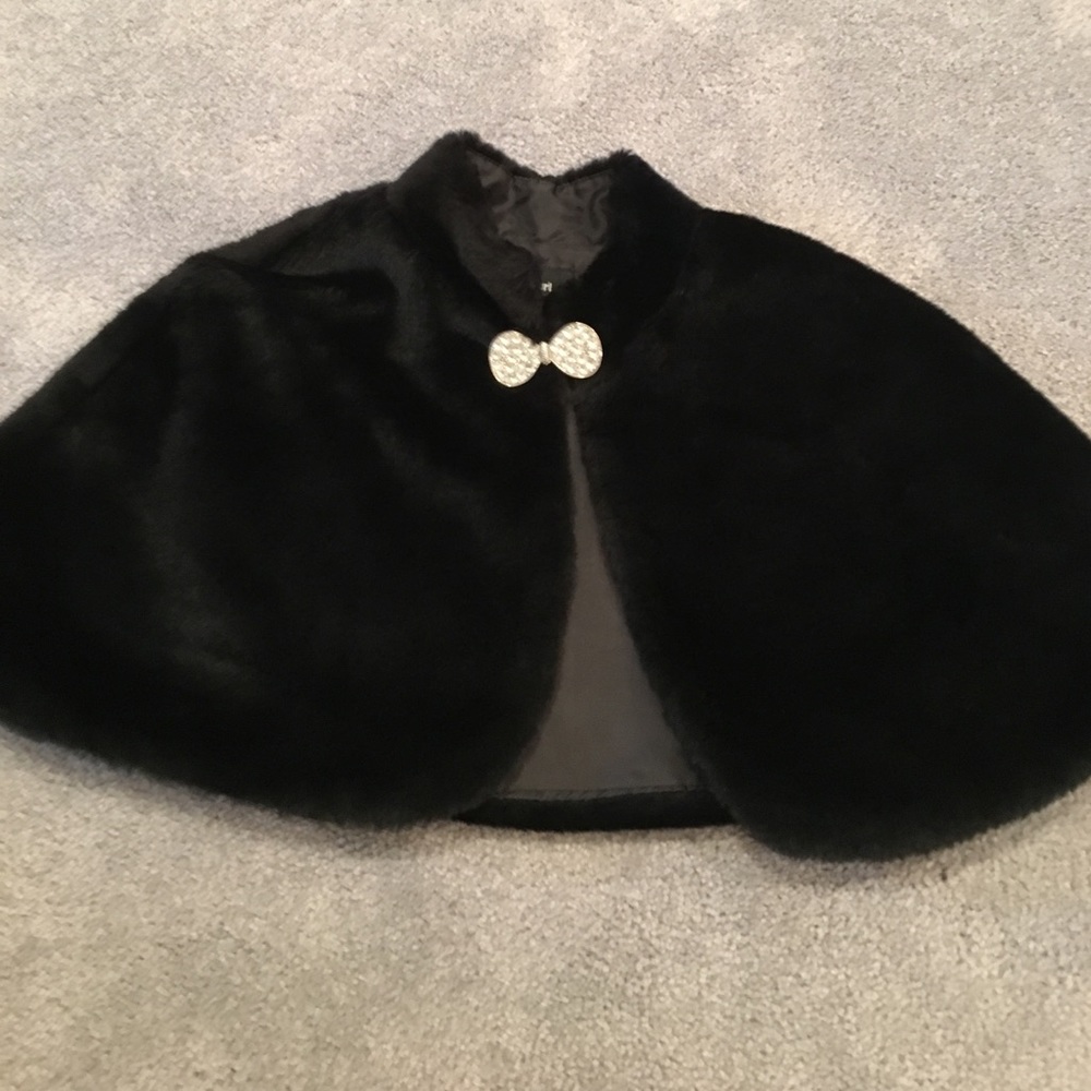 A kids nice black jacket that goes over a dress