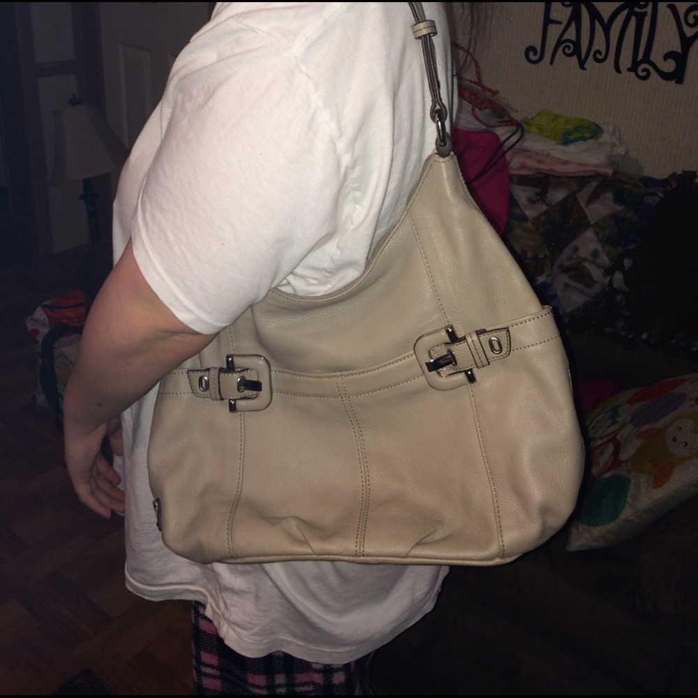 Tan handbag with several pockets
