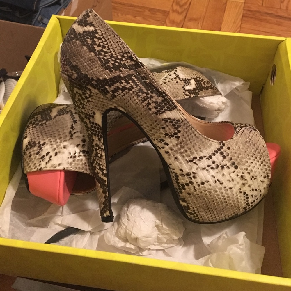 Snake skin and pink platform heels