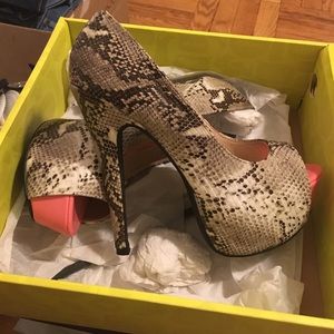 Snake skin and pink platform heels