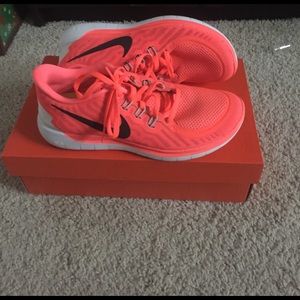 Neon orange Nike free size 9. Unworn