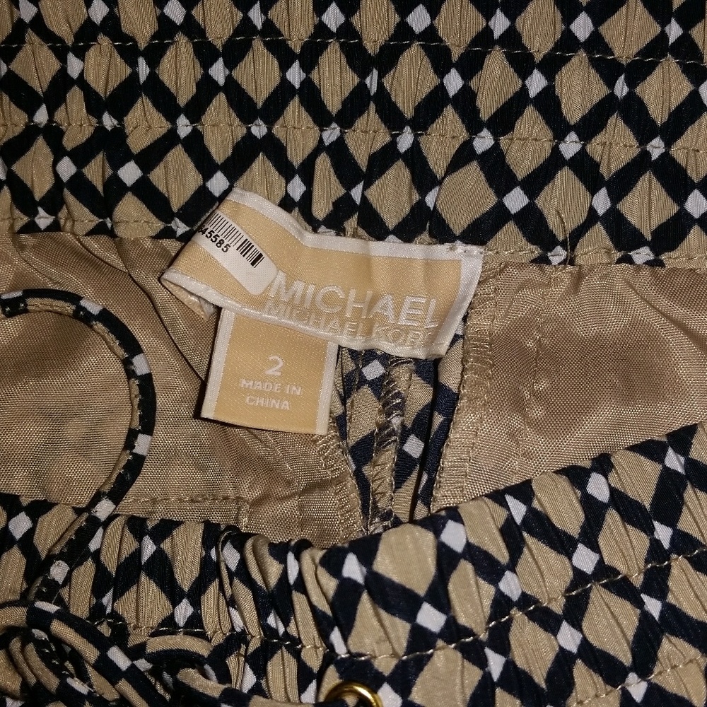Michael Kors loose pant cuff ankles.