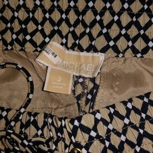 Michael Kors loose pant cuff ankles.