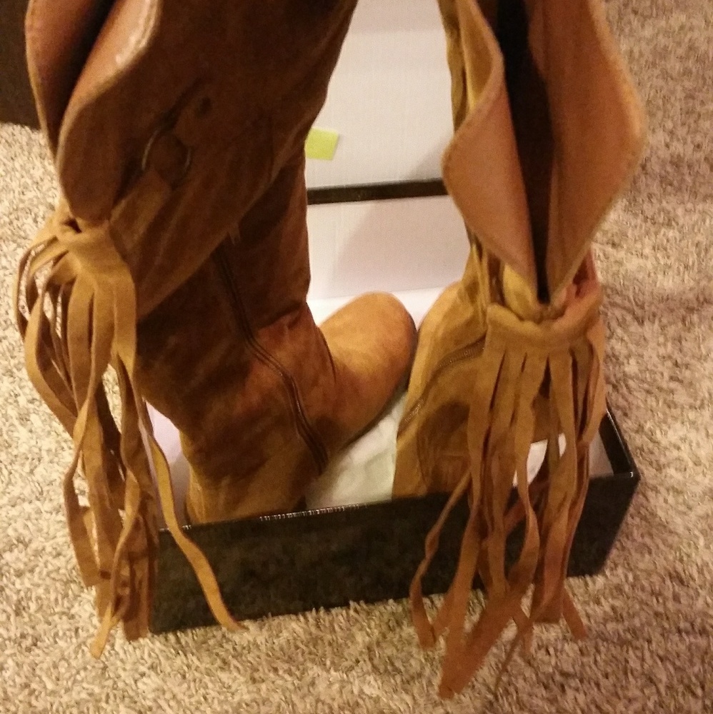 New. Never worn. Faux Suede Tall Fringe boots.