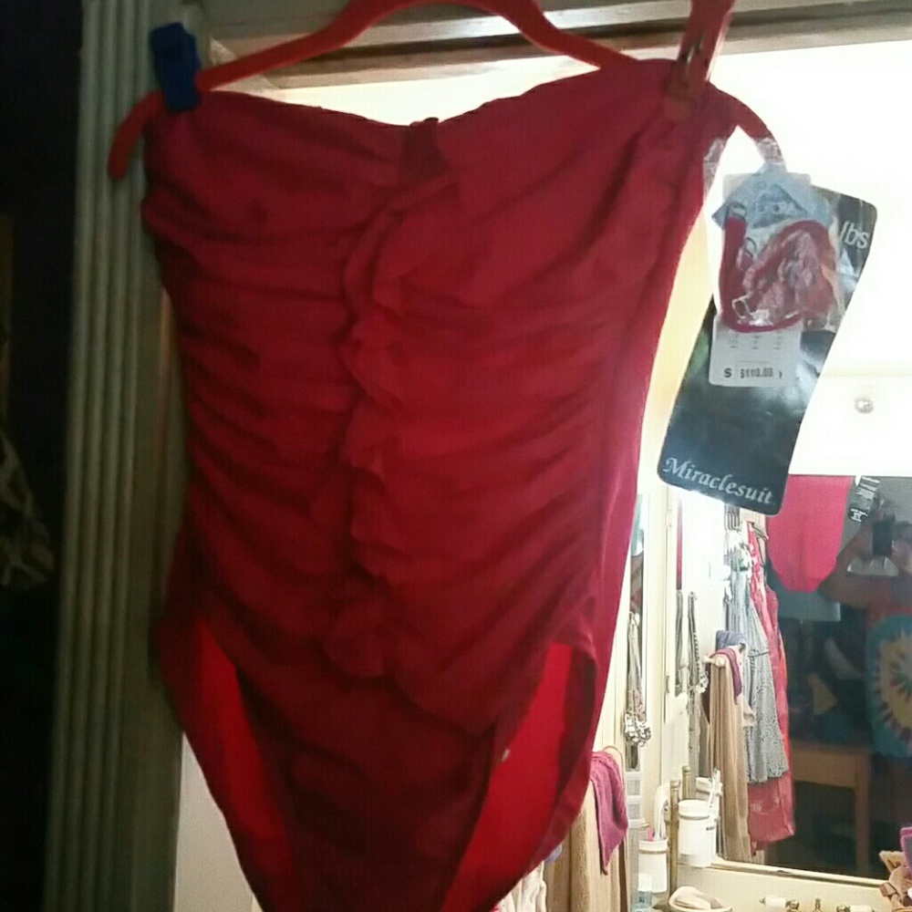 BRAND NEW SWIM SUIT..MAKES YOU LOOK 10 LBS LIGHTER