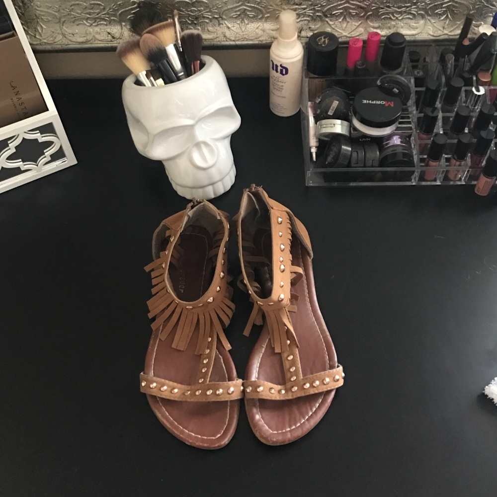 Tan moccasin fringe festival sandals