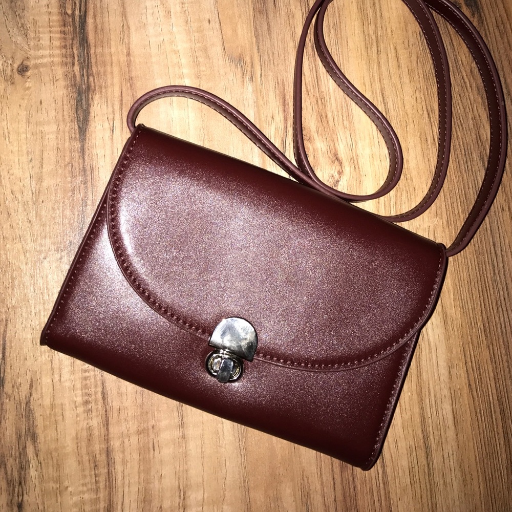 Urban outfitters burgundy bag.