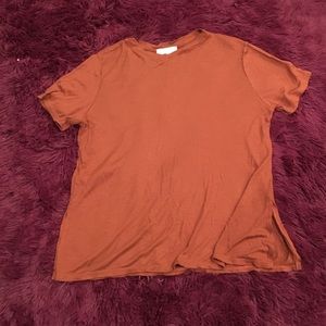 Adorable rust colored shirt with split side detail