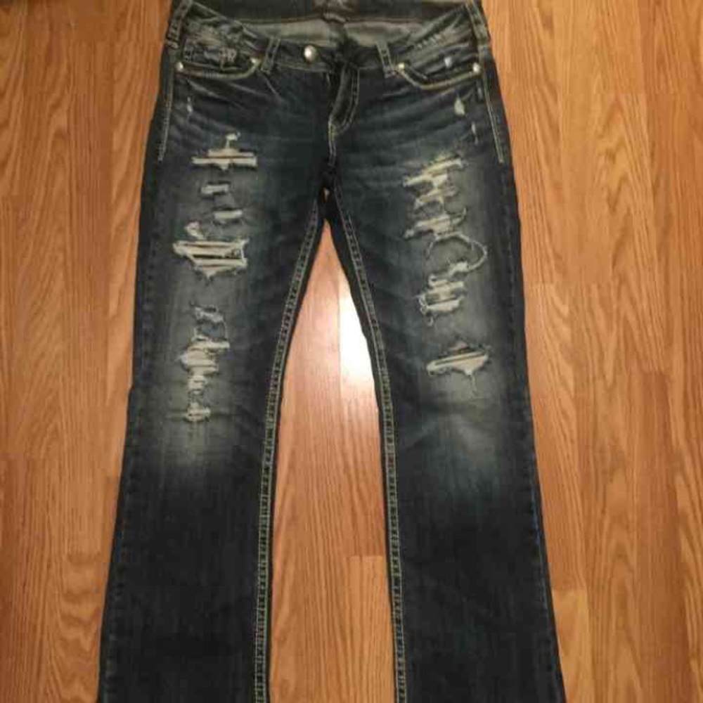 Distressed silver jeans