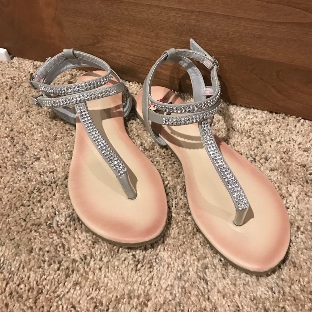 Silver sandals with jewels.