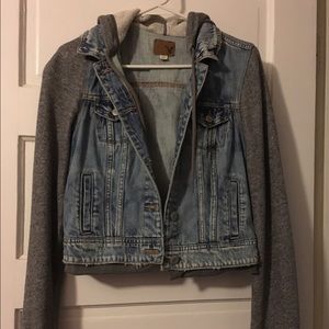 Distressed Jean jacket with sweatshirt sleeves