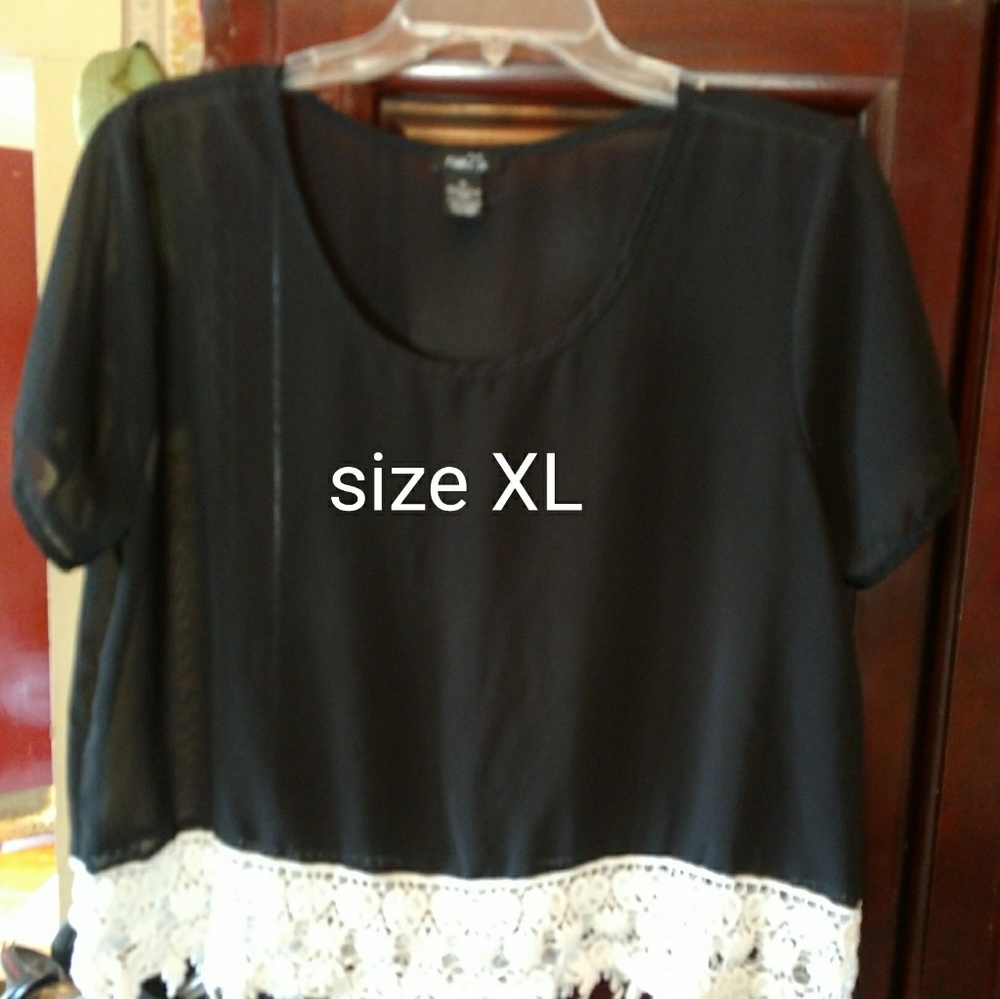 Sheer top with white lace trim.