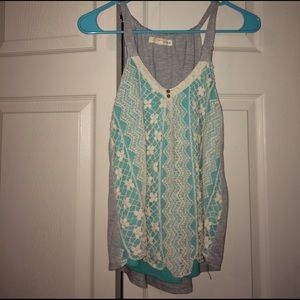 Cute tank with lace design.