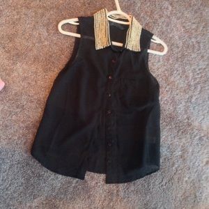 sheer blouse with ornate beaded collar.