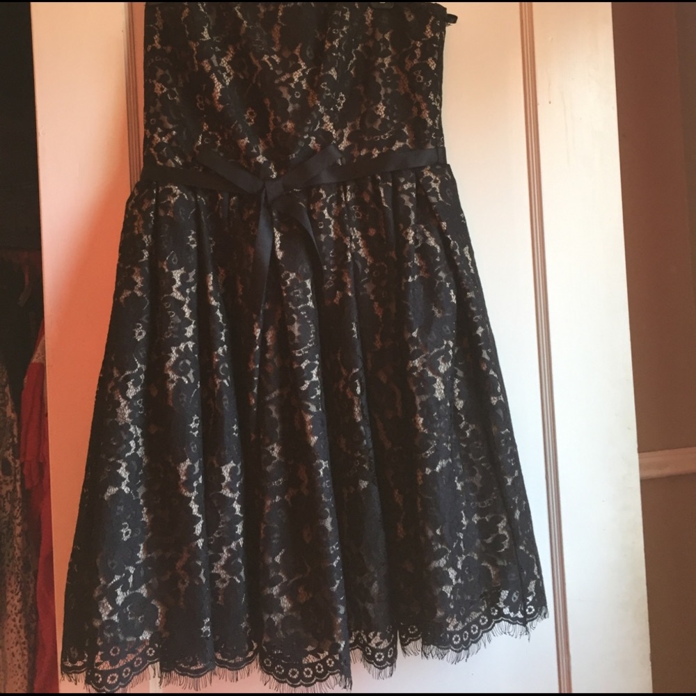 Black lace strapless dress.
