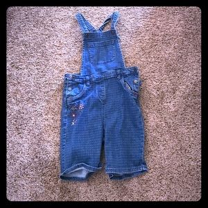 Dotted short overalls with floral print on sides