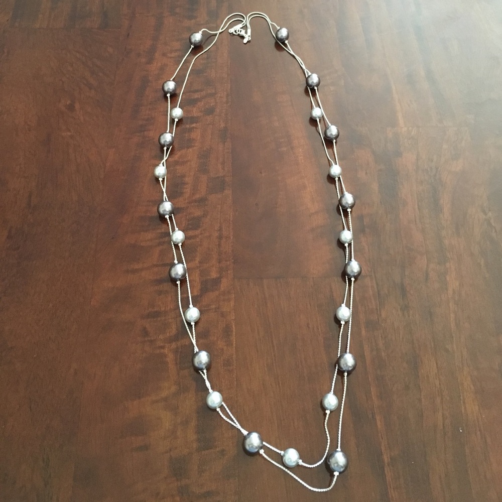 Silver bead necklace.