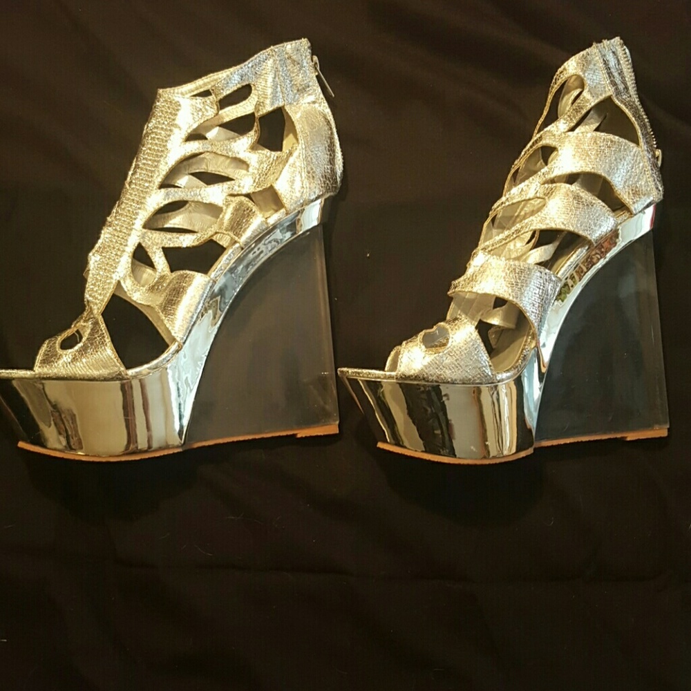 Insanely Tall Sexy glass looking wedge heels.