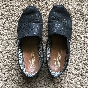 Glittery black Toms