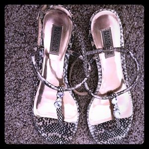Snake print sandals with gold feet print