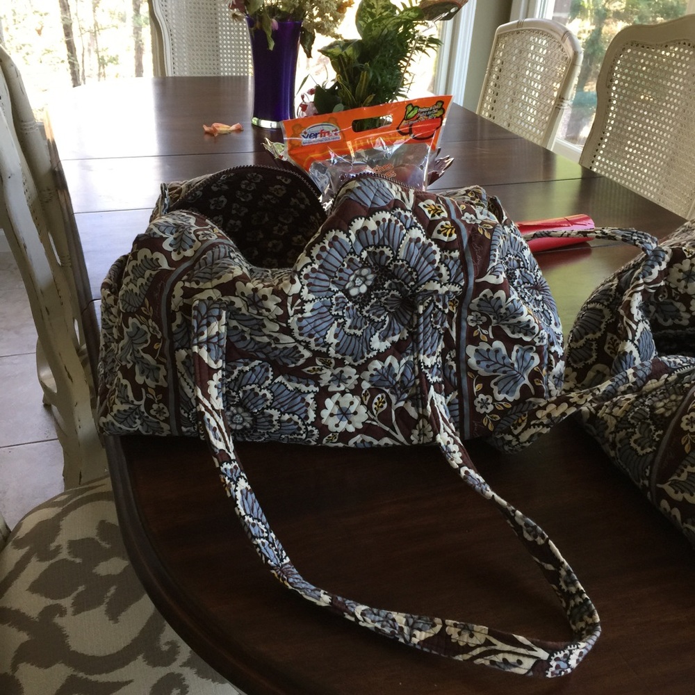 Small and large Vera Bradley duffel set.