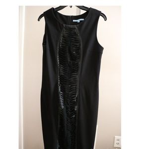 Fitted black dress with fabric detail on front
