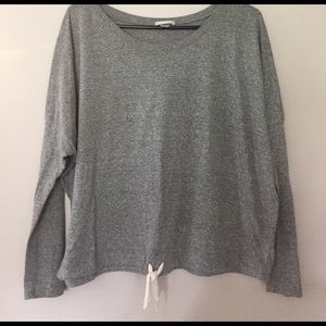 Long sleeve top with cinch wait detail.