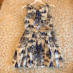 White, blue, and black sailboat dress